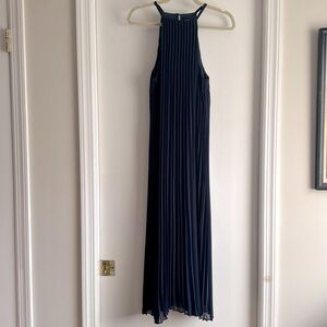 Likely pleated navy dress